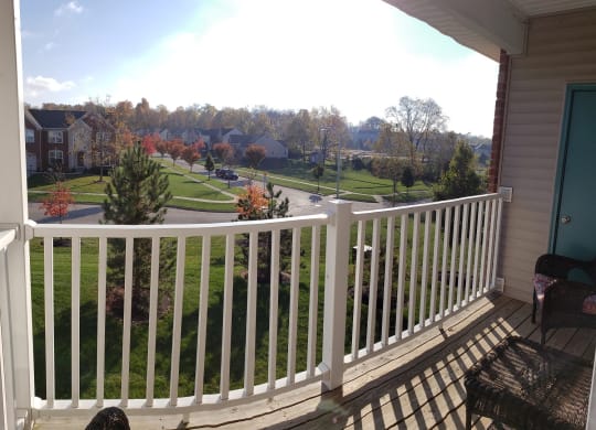A view from a balcony overlooking a suburban neighborhood. at Fieldstone*, Beavercreek, Ohio