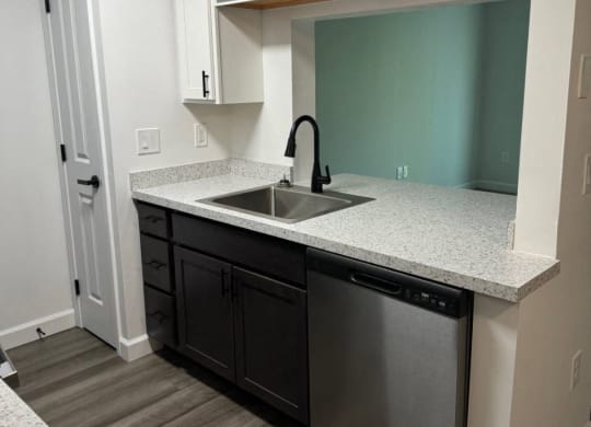 Kitchen with a sink and white cabinets  at Hilltop Apartments, Ohio