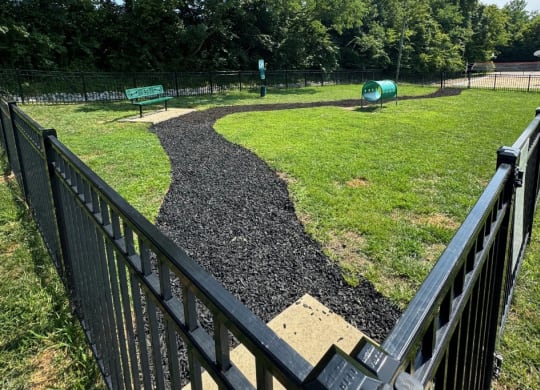 a path in a park with a fence  at Hilltop Apartments, Ohio, 45213-2638