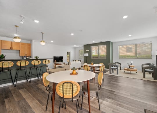 the reserve at bucklin hill clubhouse resident lounge with tables and chairs at DeSales Flats Apartments*, Cincinnati, Ohio