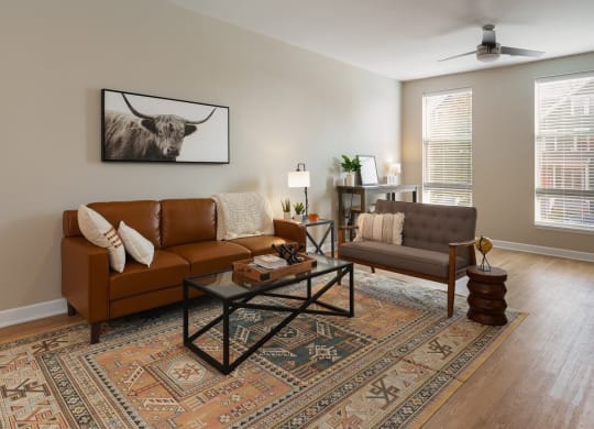 a living room with couches and a table at Adelphi Quarter, Columbus, OH