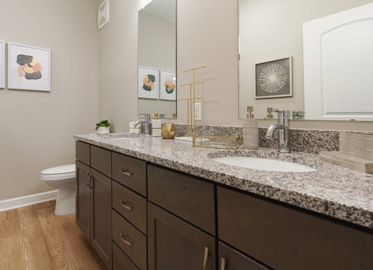 a bathroom with granite counter tops and two sinks at Adelphi Quarter, Ohio