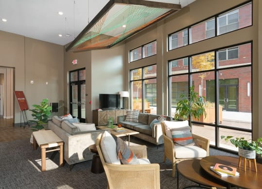 a lobby with couches and chairs and large windows at Adelphi Quarter, Ohio