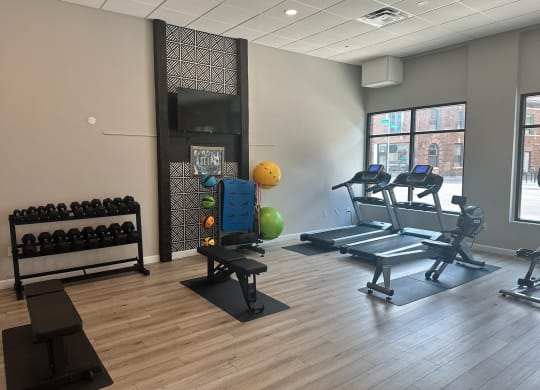 a fitness center with treadmills and other exercise equipment in a building at Adelphi Quarter, Columbus, 43203