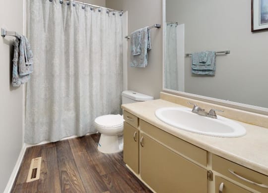 a bathroom with a toilet sink and shower at Summit at Keystone, Indianapolis