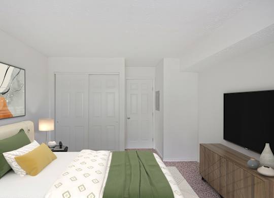 A bedroom with a bed, a lamp, a painting, and a television.