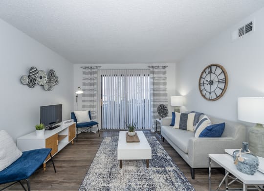 our apartments offer a living room with a couch and a tv