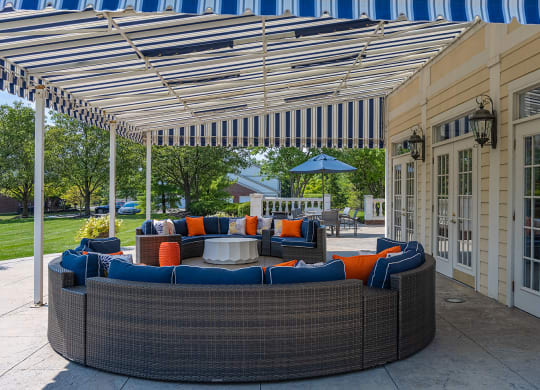 a covered patio with a blue and white striped awning at Bishops Gate, Ohio