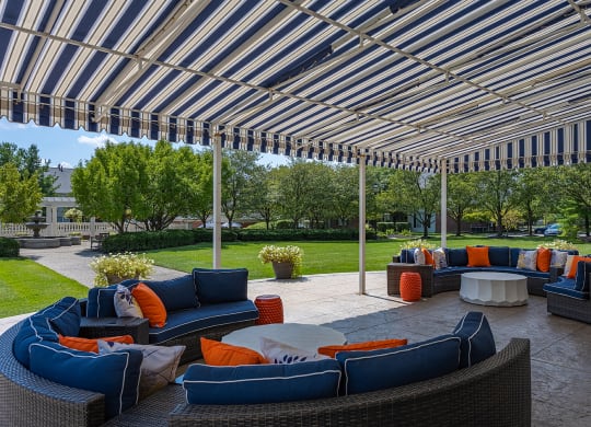 a patio with couches and tables under a canopy at Bishops Gate, Cincinnati