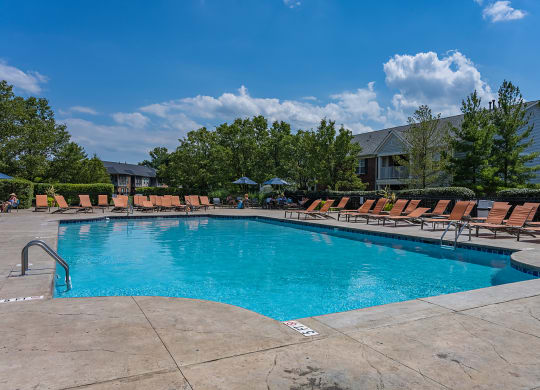 our resort style pool is filled with lounge chairs and a blue sky at Bishops Gate, Ohio, 45249