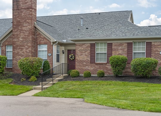a brick house with a front yard and a stairway at Bishops Gate, Ohio, 45249