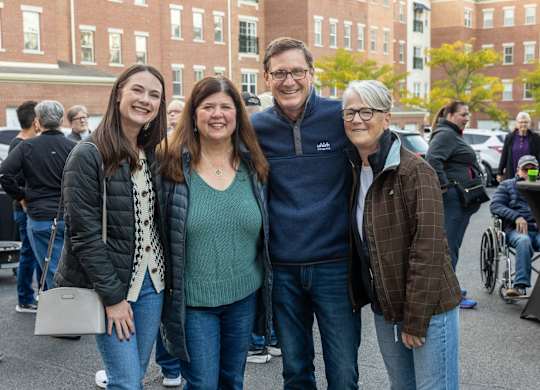 a group of people pose for a picture at Roebling Row, Kentucky