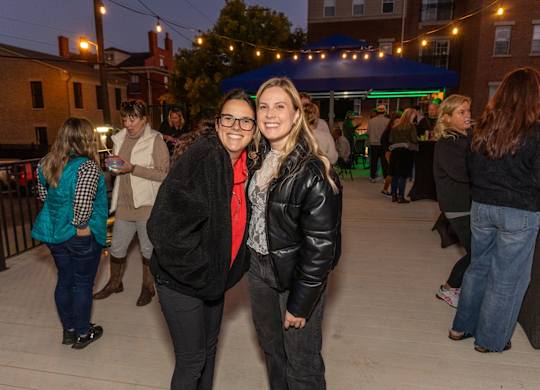 a couple of women posing for a picture at a party at Roebling Row, Kentucky, 41011-1720