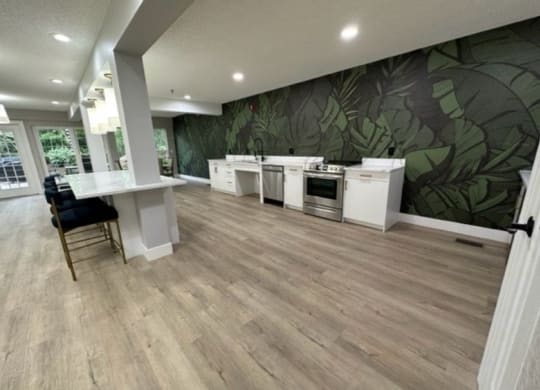 a large room with a kitchen and a dining area