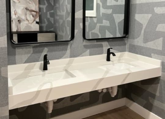 Bathroom with a gray and white wallpaper and two mirrors at Waterstone Landing, Perrysburg