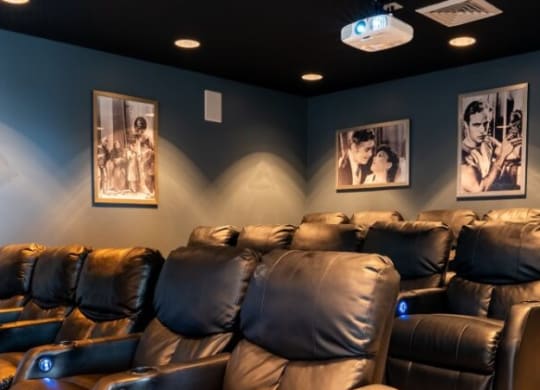 Home theater room with leather chairs and blue walls at Waterstone Landing, Ohio