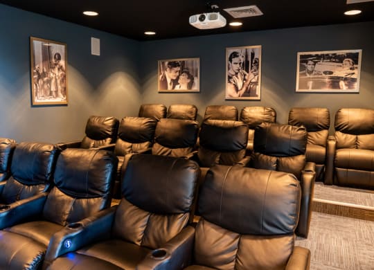Home theater room with leather chairs and pictures on the wall at Waterstone Landing, Perrysburg, OH, 43551