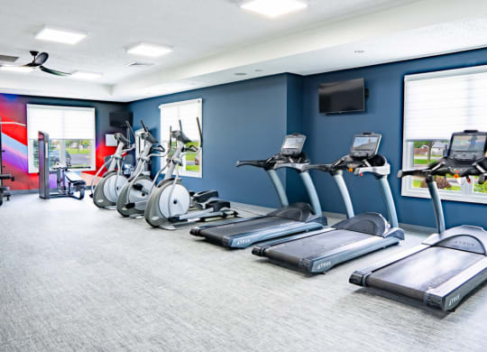 Gym with cardio machines and a television at Waterstone Landing, Ohio, 43551