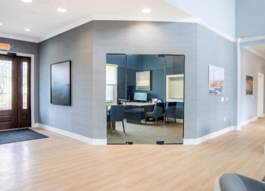 Conference room with blue walls and a large mirror at Waterstone Landing, Perrysburg, OH