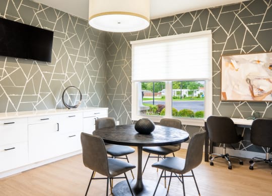 Dining room with a table and chairs and a window at Waterstone Landing, Perrysburg