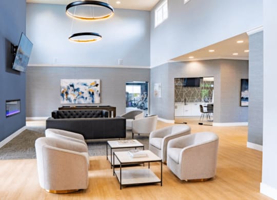 Living room with couches and chairs and a fireplace at Waterstone Landing, Perrysburg, OH