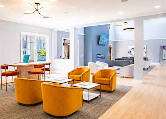 Living room with yellow chairs and a table at Waterstone Landing, Ohio, 43551