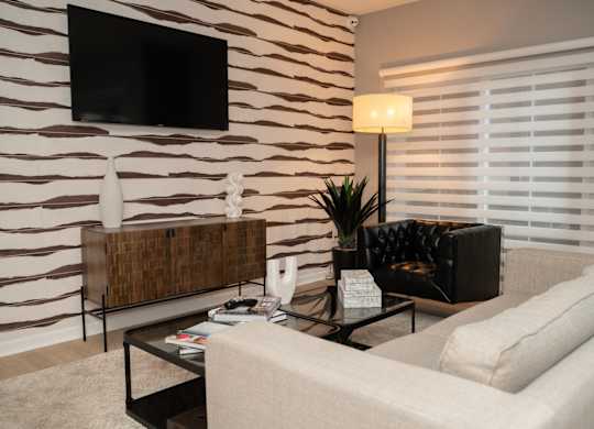a living room with a couch and a coffee table at Monmouth Row Apartments, Newport, KY