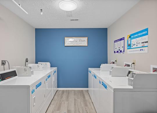 A dental office with blue walls and white equipment.