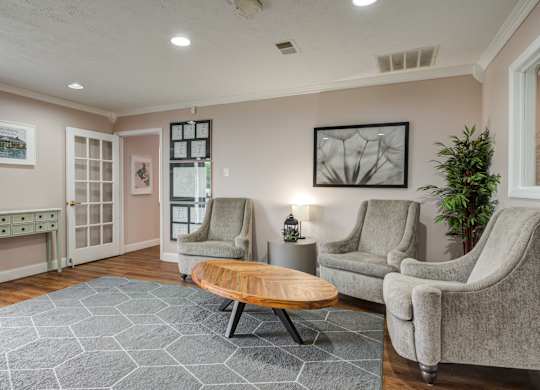 a living room with two chairs and a coffee table