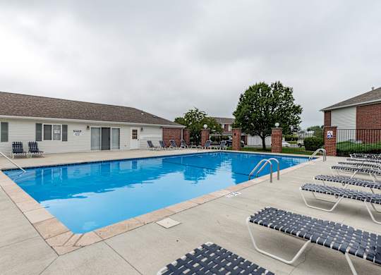 our apartments have a large swimming pool with lounge chairs