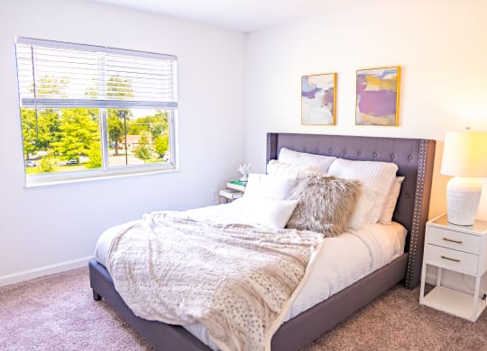 a bedroom with a bed and two night stands