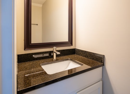 a bathroom with a sink and a mirror at Traditions at Slate Ridge, Ohio, 43068