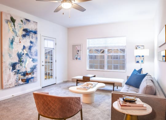 a living room with pink walls and a ceiling fan  at Waterstone Landing, Perrysburg, Ohio
