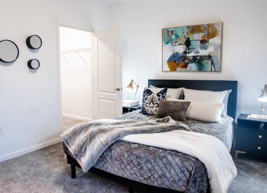 a bedroom with a bed and two nightstands  at Waterstone Landing, Perrysburg