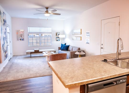 a kitchen with an island and a living room in the background  at Waterstone Landing, Perrysburg, 43551