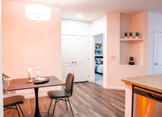 a dining area with a table and chairs  at Waterstone Landing, Perrysburg, OH