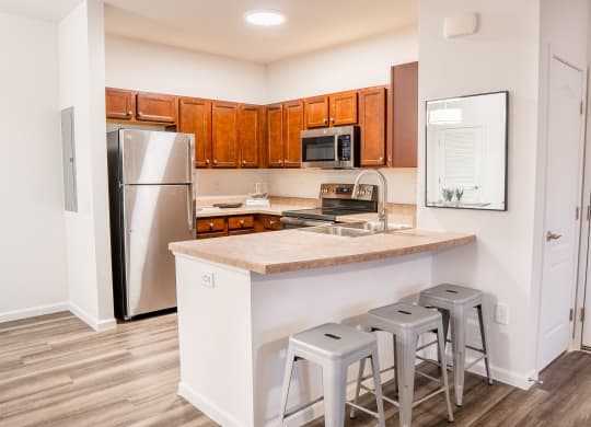 a kitchen with a large island and stainless steel appliances at Waterstone Landing, Ohio, 43551