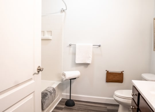 a bathroom with a toilet and a bathtub  at Waterstone Landing, Ohio