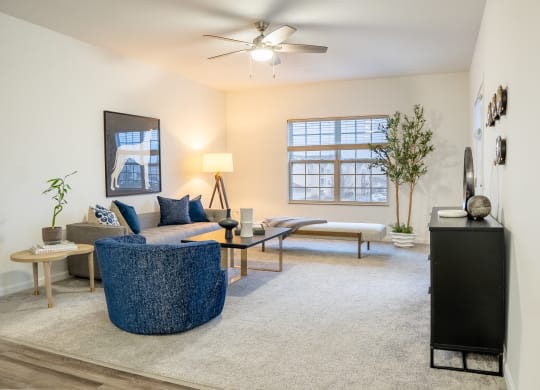 a living room with a couch coffee table and a tv  at Waterstone Landing, Perrysburg