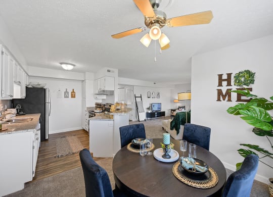 Living room with a dining table and a kitchen at Wrights Point, 41011