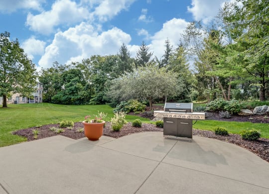 Community patio with grill and beautifully landscaped!