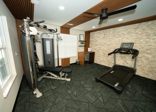 Home gym with exercise equipment and a window at Honey Creek, 46143