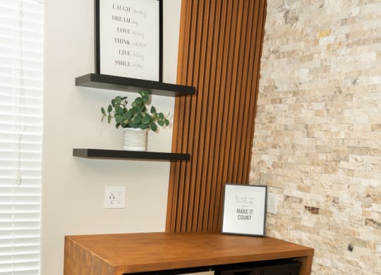 Room with a fireplace and a wooden cabinet with rocks in it at Honey Creek, 46143