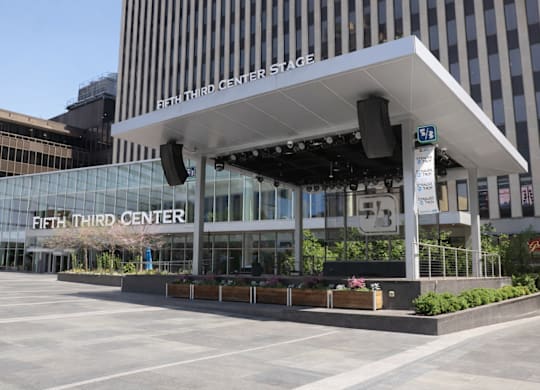 The Fifth Third Center Stage is a large building with a glass facade.