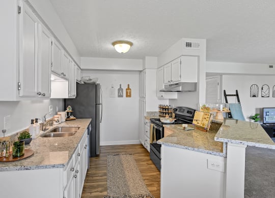 Kitchen with white cabinets and granite counter tops at Wrights Point, Ft Wright, KY, 41011