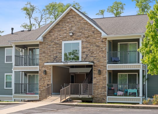 Brick house with two balconies and a porch at Galbraith Pointe Apartments and Townhomes, Cincinnati, OH