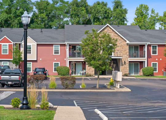 Street view of an apartment building with a parking lot at Galbraith Pointe Apartments and Townhomes, Ohio