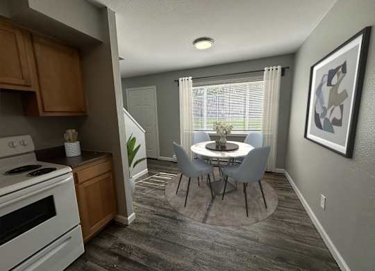 a kitchen and dining room with a table and chairs