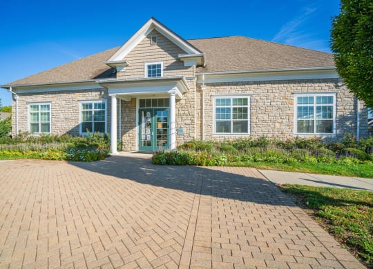 a brick sidewalk in front of a brick house at Grove City Summit Apartments, Grove City, Ohio