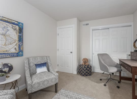 Living room sitting chairs at Harpers Point Apartments, Cincinnati